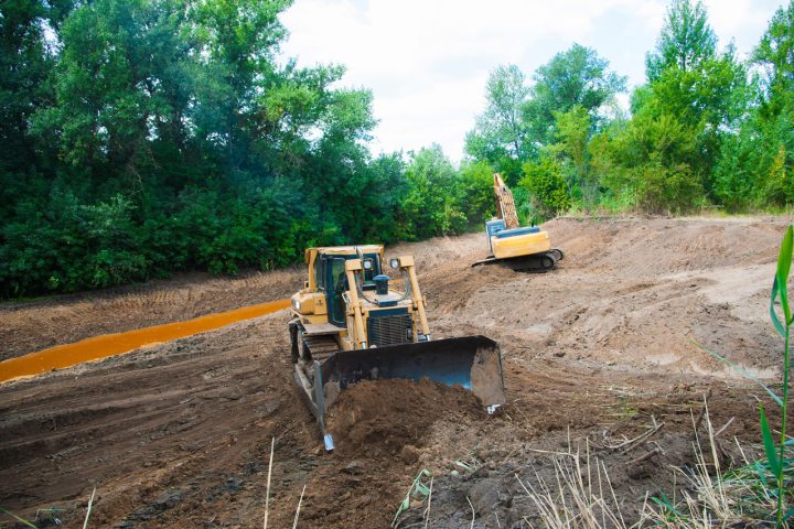 Grading the slopes in a residential property, minimizing potential erosion